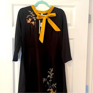 Black dress with yellow bow